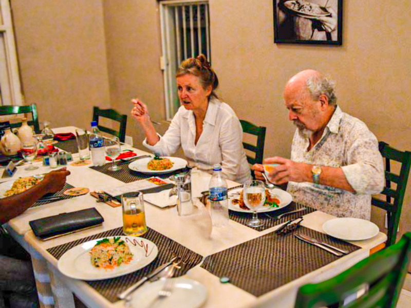 Couple enjoying traditional Sri Lankan cuisine at local restaurant on Rustic Taste cultural food tour