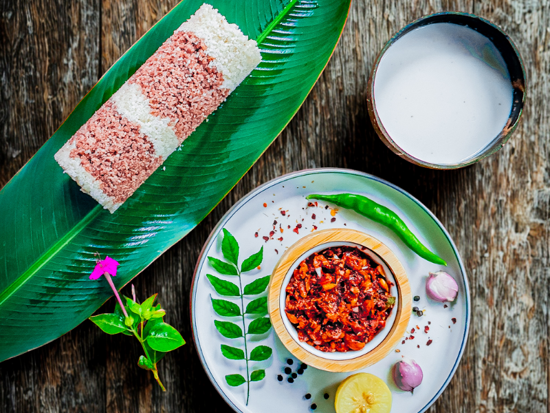Traditional Sri Lankan Lunu Miris and Pittu served on a banana leaf during Rustic Colombo food tours