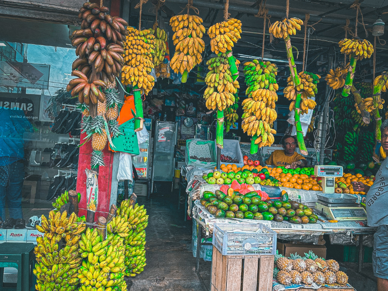 Fresh tropical banana display at local fruit market on Colombo food tour adventure in Sri Lanka