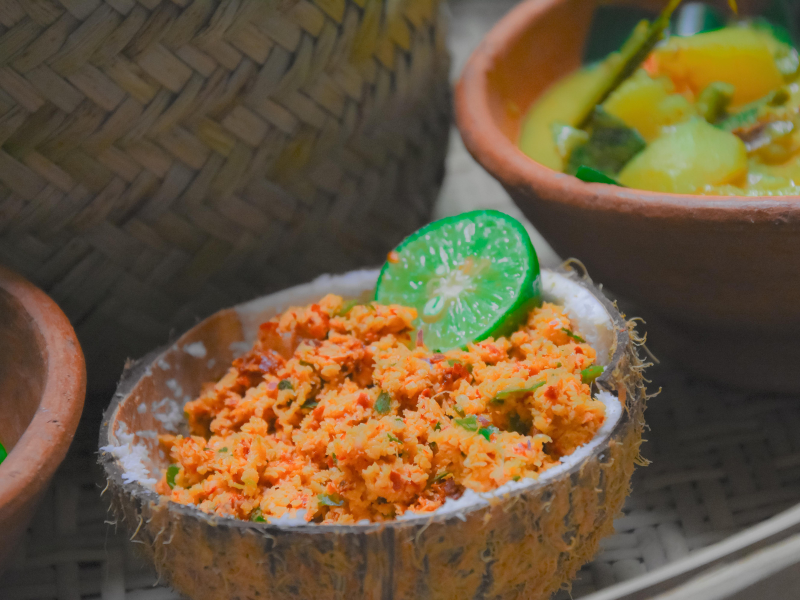 Close-up of freshly made Coconut Sambol served in a traditional coconut shell on a Colombo food tour